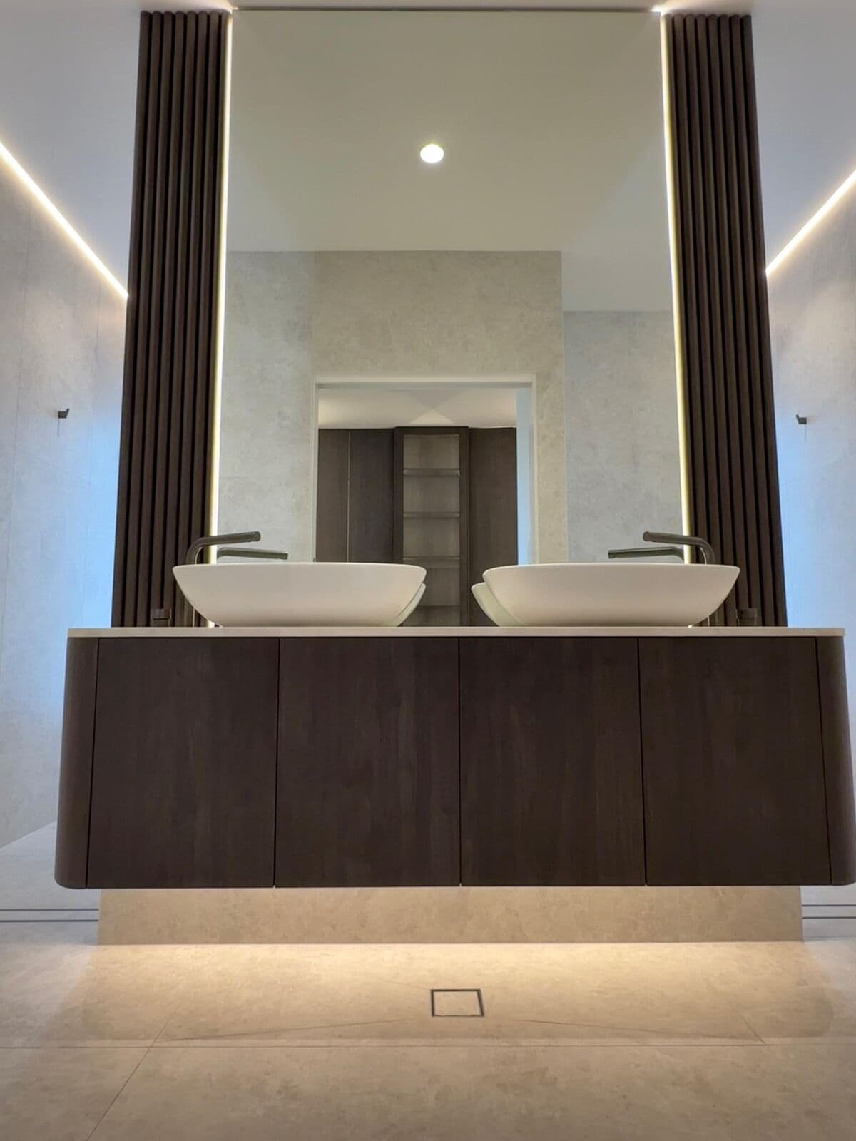 Floating bathroom vanity with lighting underneath