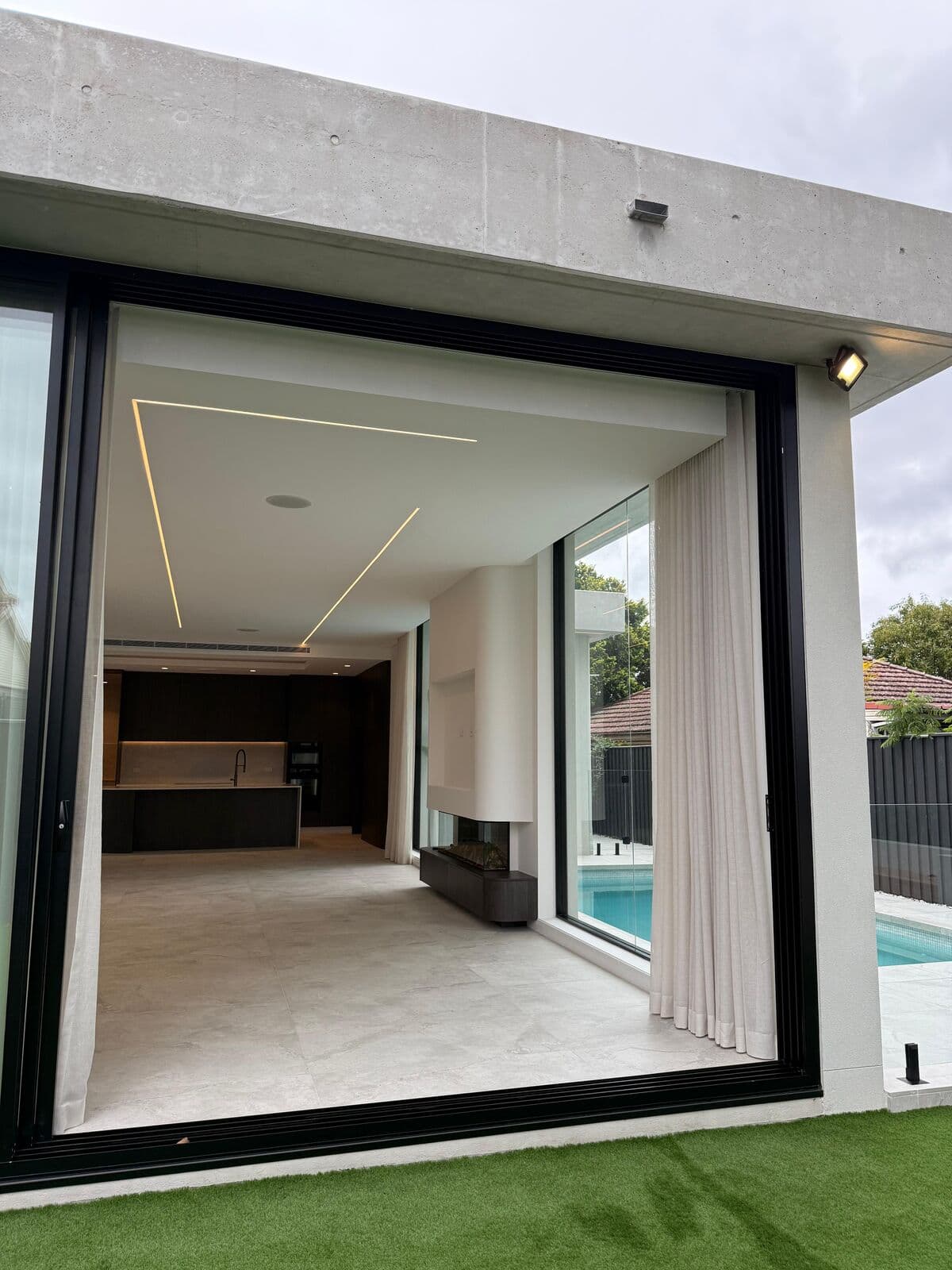 Sliding glass doors opening onto a residential outdoor area