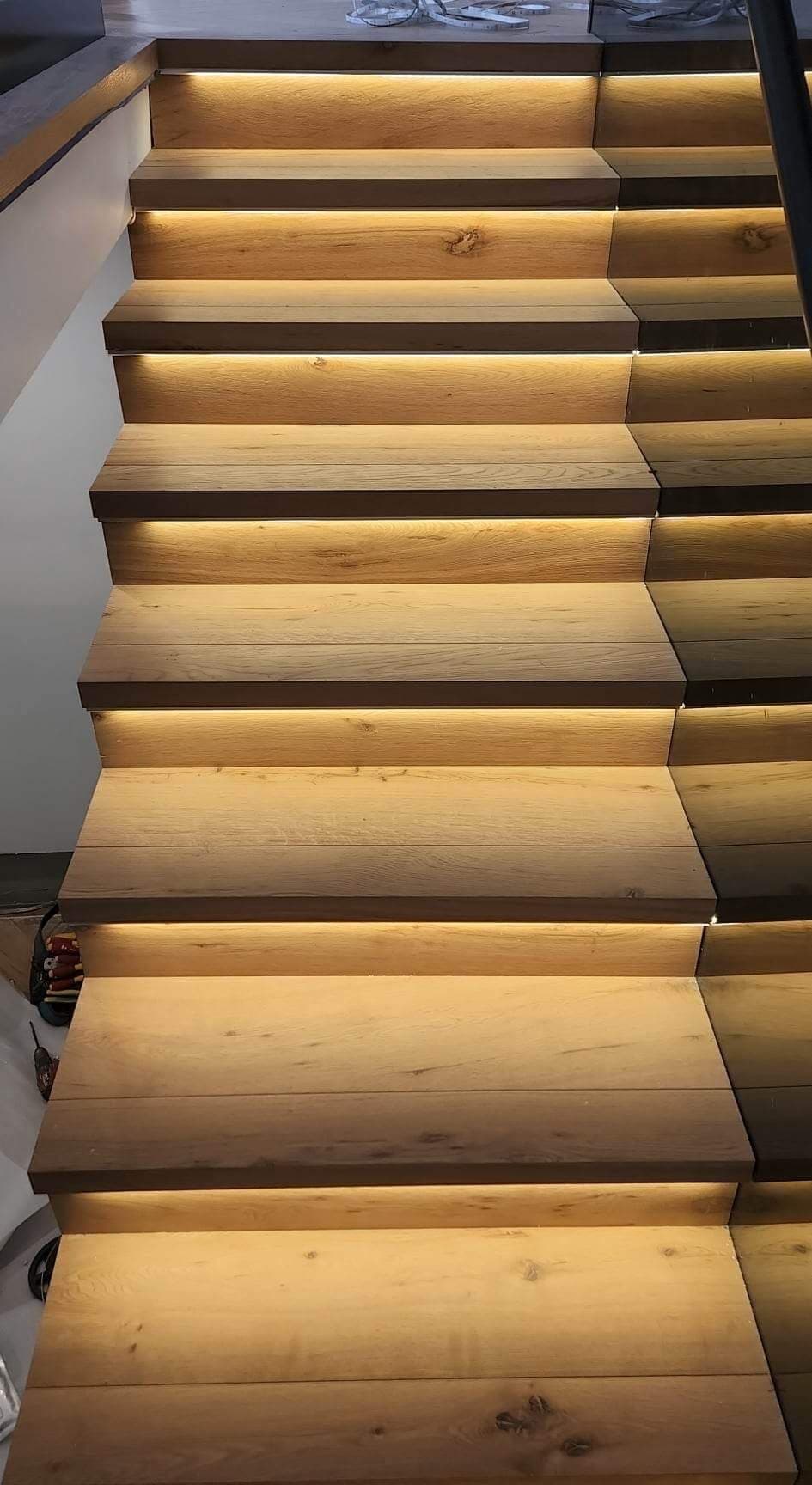 Timber staircase with lighting beneath each tread