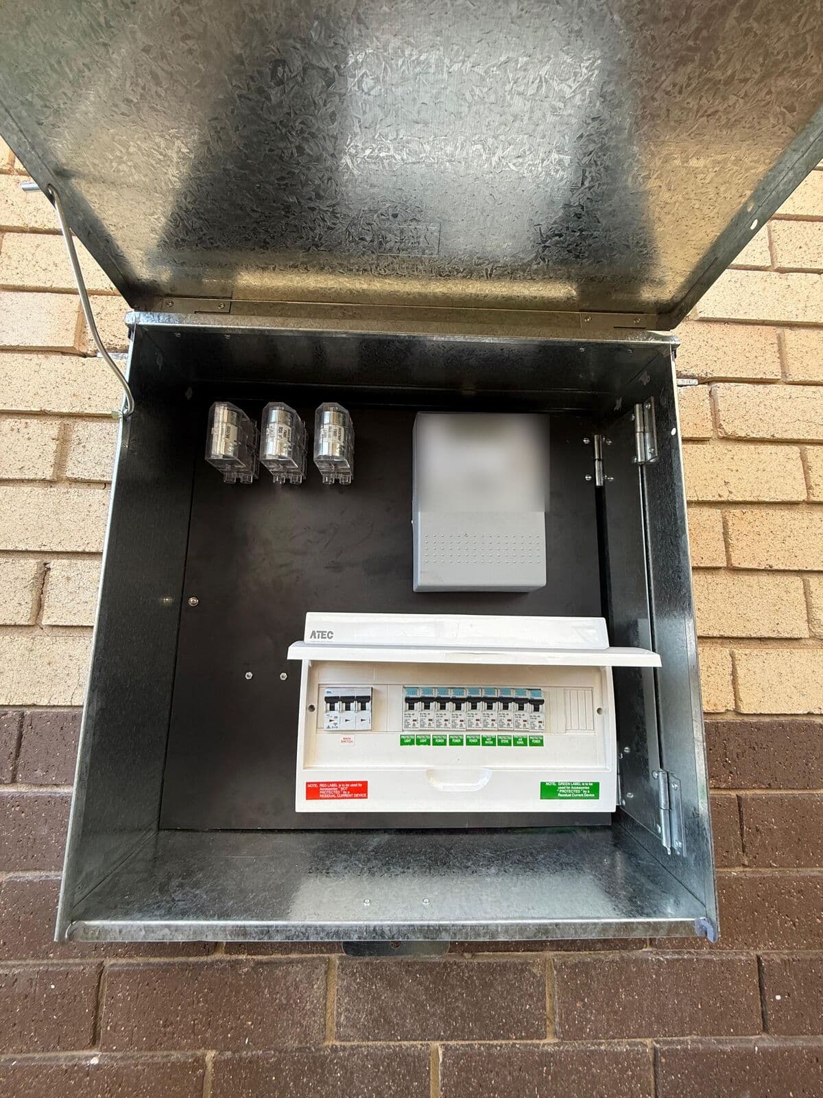 New switchboard with circuit breakers and safety switches in an outdoor meter box