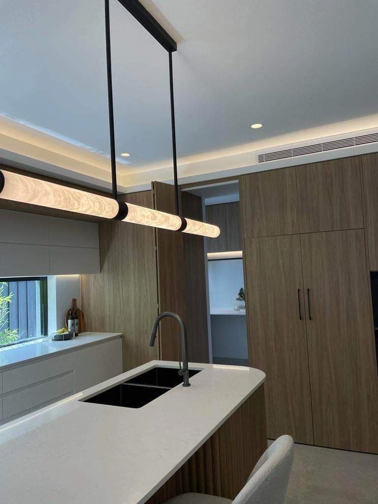 Linear pendant above a kitchen island and sink